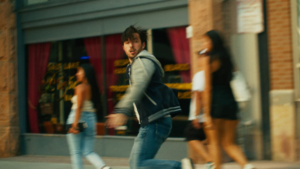 Untitled Dan runs on the sidewalk - from Last Reckoning, an indie crime thriller movie
